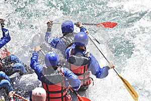 Rafting team splashing