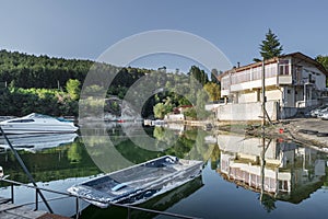 Rafts moored on a placid lake