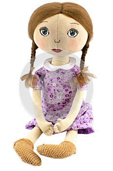 Rag-doll girl with blond hair dressed in purple