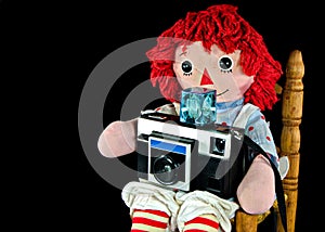 Rag doll with retro camera
