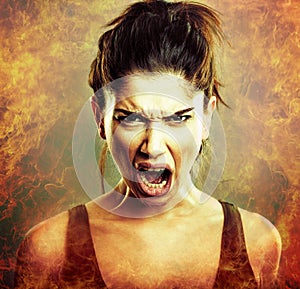 Rage explosion. Scream of angry woman photo