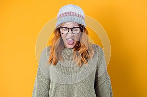 Rage woman looking at camera and screaming  isolated on yellow background. Frustrated female person