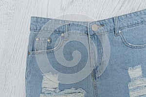 Ragged denim shorts. Close up. Fashionable concept.