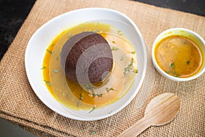 Ragi Mudde, finger millet balls with Dal curry snack in Karnataka, India