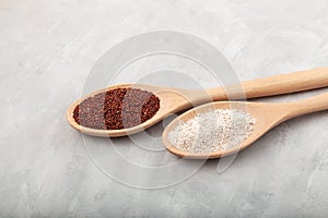 Ragi or Nachni, also known as finger millet and ragi coarse flour in wooden spoons on grey background