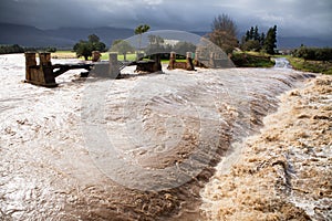 Raging flood waters of a river in flood