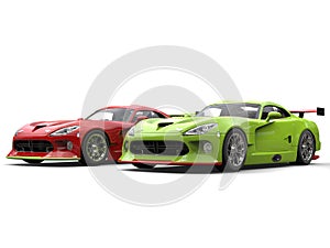 Raging red and crazy green super race cars side by side on start line