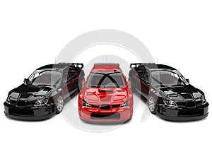 Raging red GT race car in between black race cars photo