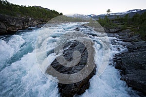 Raging river in mountain plateau Valdresflye, Jotunheimen
