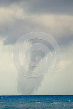 Raging Tornado over Blue Ocean