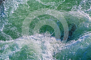 Raging water in whirpool of the mountain river