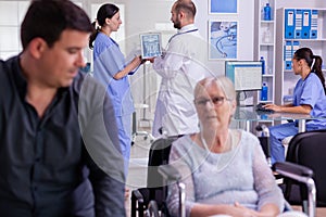 Ragiologist doctor examining radiography test result with nurse