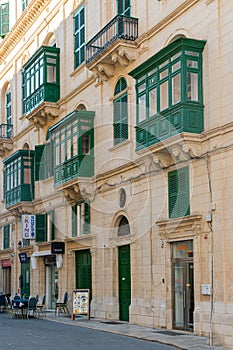 Valetta- Malta. Traditional ornate balconies painted in green photo