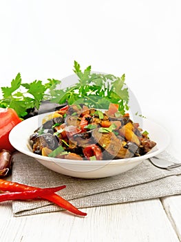 Ragout with eggplant and pepper on table
