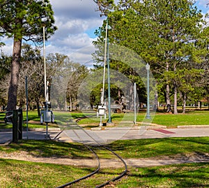 Rai road crossing with gates at Hermann Park Houston Texas USA