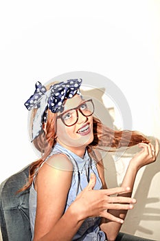 Raid haired girl with glasses smile