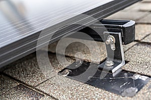 Rail, bracket, and anchor to a solar panel installed on a asphalt shingle roof