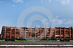 A rail car loaded with logs