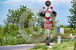 Rail crossing. Stop sign and St. Andrew Cross sign. photo