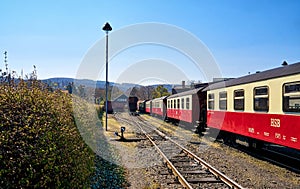 Rail network of the narrow-gauge railway with red railroad cars at a train station in Wernigerode. Brockenbahn in the Harz