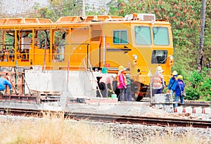 Rail repair With machines and workers. Machine repairing railway, workers were building a railway.