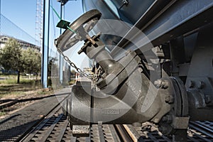 Rail tank with detail of the drain cock on the railroad loading station, Slovenia