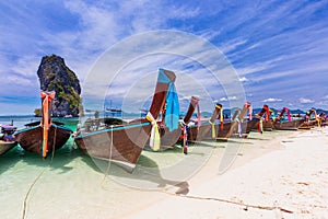 Railay beach with colorful long tail boats in Krabi, Thailand
