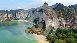 Railay beach in Thailand, Krabi province, aerial bird`s view of tropical Railay and Pranang beaches with rocks and palm trees photo