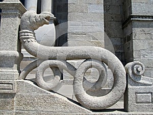 Railing in the form of stone snake. An element of the building's architecture.