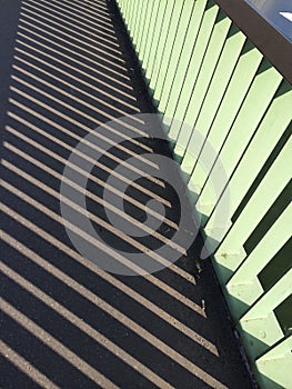 railing shadow on a bridge