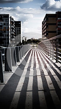 Railing shadow on a bridge