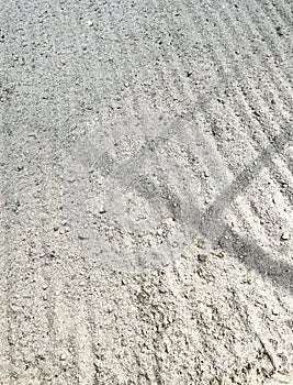 Railing shadow on sand ground