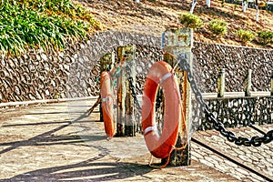 Railings and life buoys by the lake in the park