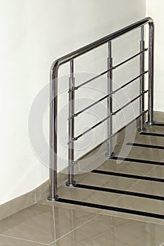 Railings made of stainless pipes on an inclined passage in an office building