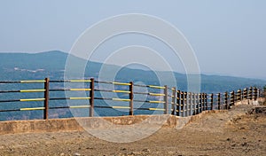 Railings of metal pipe fence or round steel fence around the edge of the mountain