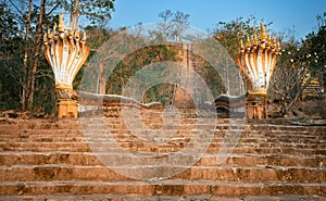 The railings of the stairs are. the Naga snake. Pakse, Laos photo