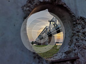 Railroad bridge across the river  train moving along in Kyiv