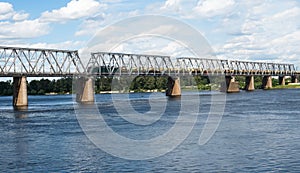 Railroad bridge in Kyiv across the Dnieper with freight train