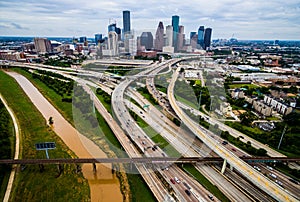 Railroad Bridge Urban Sprawl Bridge and Overpasses High Aerial Drone view over Houston Texas Urban Highway view