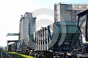 Railroad cars at cement manufacturing plant. Ready-mix and building materials. End products being shipped by rail from the