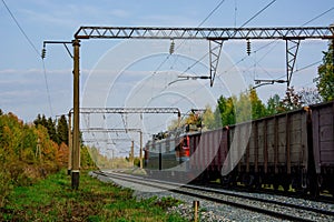 Railroad cars loaded with coal. Freight train. Wagons on the railway