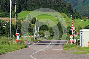 Railroad crossing with gates in German countryside