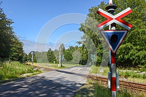 Railroad crossing gate on the forest at Gribskov, Denmark