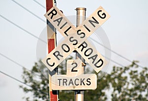 Railroad crossing sign with 2 tracks