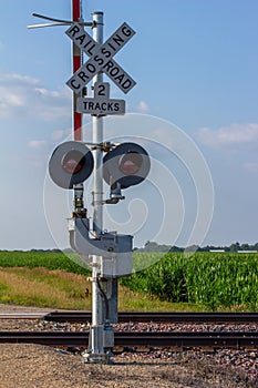 Railroad crossing sign in a rural setting