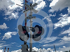 Railroad crossing signal lights and sign