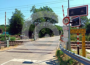 Railroad crossing with signs in Luxembourg