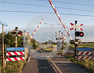 A railroad crossing while a train is nearing