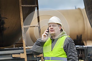 Railroad employee with cell phone