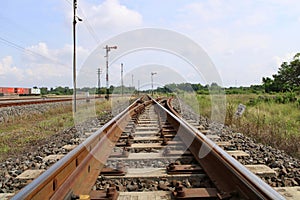 Railroad on gravel in the cloudy day.